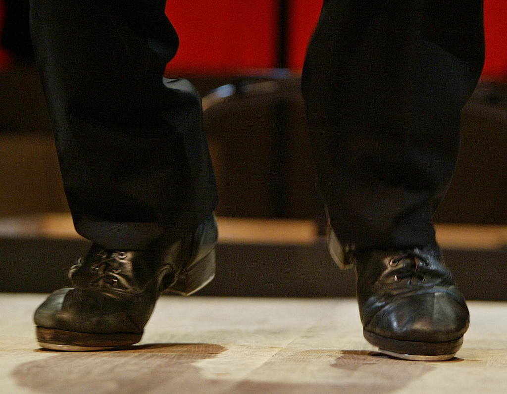FILE - Tap sensation Savion Glover dances a number during a dress rehearsal for "Classical Savion," Jan. 4, 2005, at the Joyce Theater in New York. (AP Photo/Kathy Willens, File)