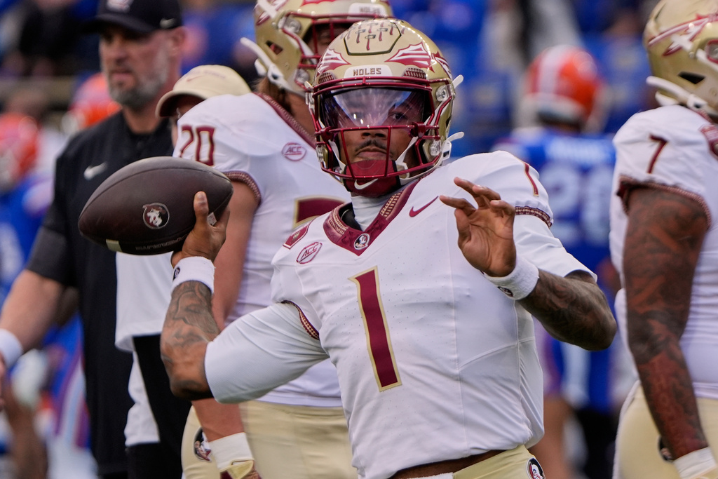 Florida State quarterback Tommy Castellanos warms up before an NCAA college football game against Florida, Saturday, Nov. 29, 2025, in Gainesville, Fla. (AP Photo/John Raoux)