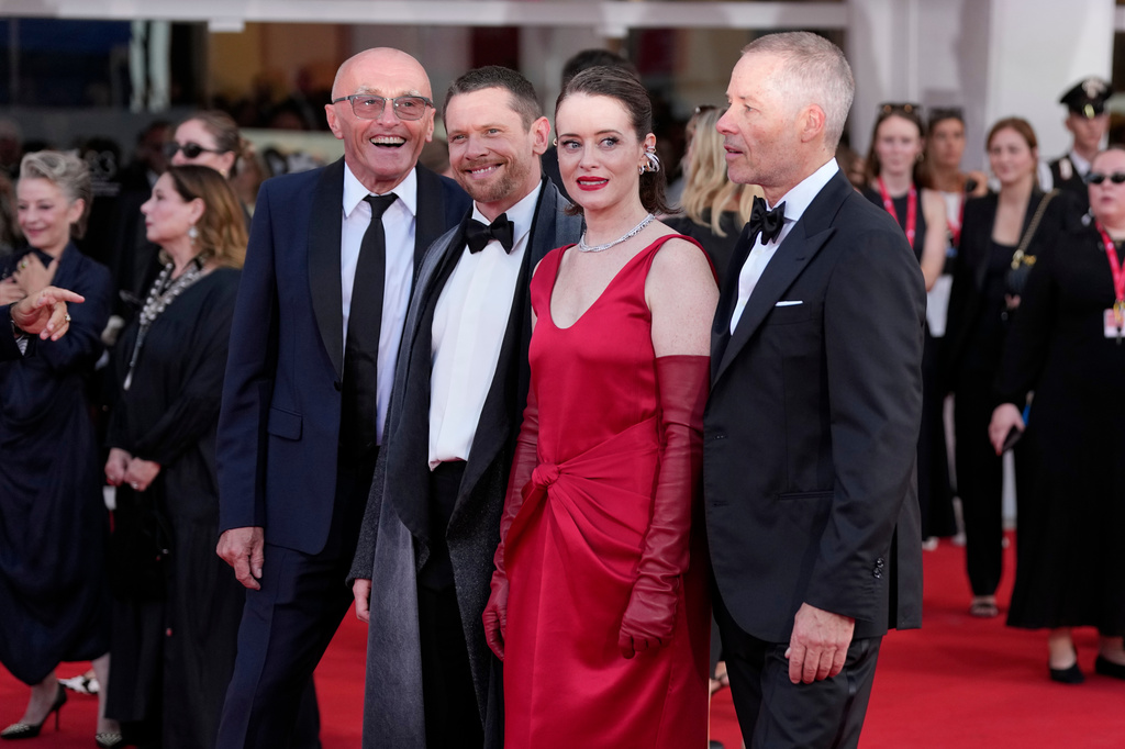 Director Danny Boyle, from left, Jack O'Connell, Claire Foy and Guy Pearce pose for photographers at the opening ceremony and the red carpet for the film 'Ink' during the 83rd edition of the Venice Film Festival in Venice, Italy, on Wednesday, Sept. 2, 2026. (Photo by Alessandra Tarantino/Invision/AP)