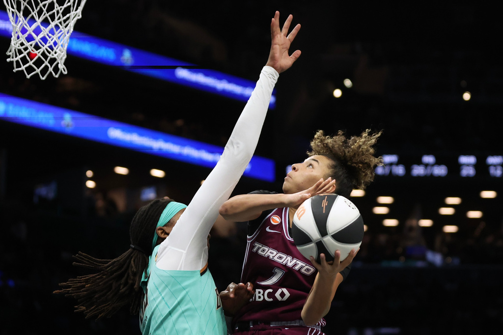 Toronto Tempo guard Kiki Rice (1) drives to the basket against New York Liberty center Jonquel Jones during the second half of a WNBA basketball game, Wednesday, June 3, 2026, in New York. (AP Photo/Heather Khalifa)