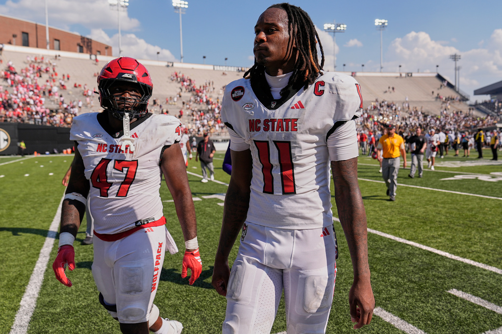 North Carolina State quarterback CJ Bailey (11) walks off the field after the team's loss in an NCAA college football game against Vanderbilt, Saturday, Sept. 19, 2026, in Nashville, Tenn. (AP Photo/George Walker IV)