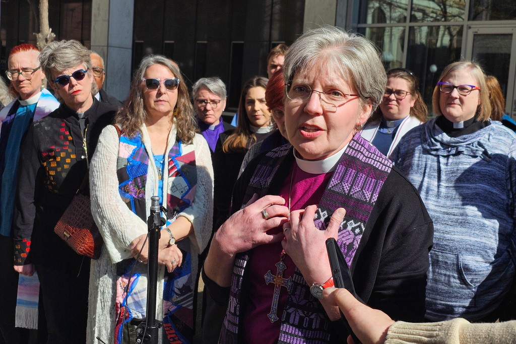 Bishop Jennifer Nagel, of the Minneapolis Synod of the Evangelical Lutheran Church in America, speaks to reporters outside the federal courthouse in St. Paul, Minn., on Friday, March 20, 2026, after a federal judge ruled that clergy will be allowed to minister to immigrants in a holding facility at the headquarters of the Trump administration's enforcement surge in Minnesota. (AP Photo/Steve Karnowski)