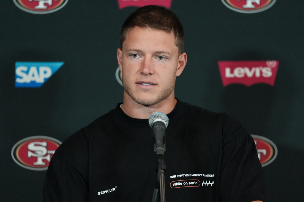 San Francisco 49ers running back Christian McCaffrey speaks to the media ahead of practice Monday, Sept. 7, 2026, in Melbourne, Australia, in preparation for an NFL football game against the Los Angeles, Rams. (AP Photo/Asanka Brendon Ratnayake)