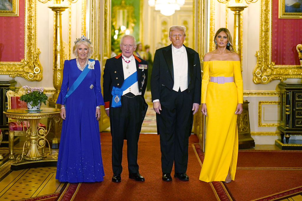 Britain's King Charles III, centre left, and U.S. President Donald Trump, centre right, pose with Queen Camilla and First Lady Melania Trump, right, at the state banquet at Windsor Castle, England, on day one of the president's second state visit to the UK, Wednesday Sept. 17, 2025. (Aaron Chown/PA via AP, Pool)