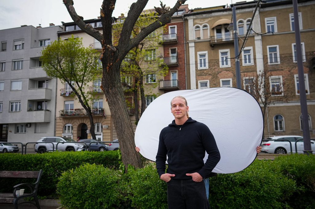 Patrik Gal, 23, poses for a portrait in Budapest, Hungary, Monday, April 13, 2026. "It's about getting a fresh start and seeing what it could bring for us." (AP Photo/Petr David Josek)
