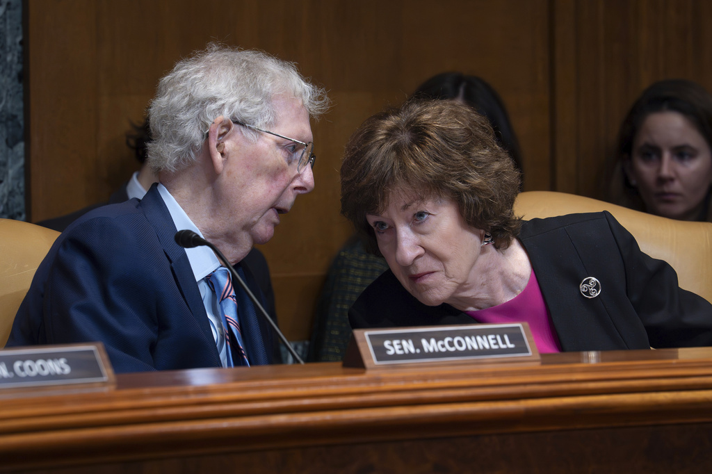 Sen. Mitch McConnell, R-Ky., chair of the Senate Defense Appropriations Subcommittee, left, confers with Sen. Susan Collins, R-Maine, chair of the Senate Appropriations Committee, as they hear President Donald Trump's funding requests for the Army, at the Capitol in Washington, Tuesday, May 19, 2026. (AP Photo/J. Scott Applewhite)