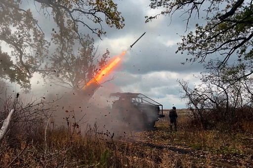 In this image made from video provided by the Russian Defense Ministry Press Service on Friday, Oct. 31, 2025, a Russian "Grad" self-propelled 122 mm multiple rocket launcher fires towards Ukrainian positions on an undisclosed location in Ukraine. (Russian Defense Ministry Press Service via AP) In this image made from video provided by the Russian Defense Ministry Press Service on Friday, Oct. 31, 2025, a Russian "Grad" self-propelled 122 mm multiple rocket launcher fires towards Ukrainian positions on an undisclosed location in Ukraine. (Russian Defense Ministry Press Service via AP)
