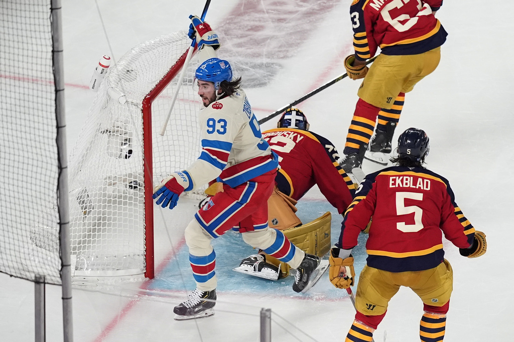 New York Rangers center Mika Zibanejad (93) celebrates after scoring against the Florida Panthers goaltender Sergei Bobrovsky (72) during the first period of the NHL Winter Classic outdoor hockey game, Friday, Jan. 2, 2026, in Miami. (AP Photo/Rebecca Blackwell)