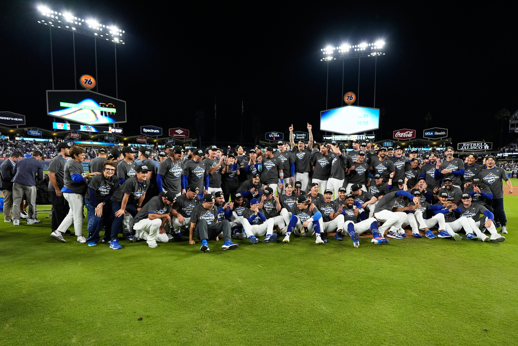 Los Angeles Dodgers pose after their win against the Milwaukee Brewers in baseball's National League Championship Series, Friday, Oct. 17, 2025, in Los Angeles. (AP Photo/Ashley Landis)