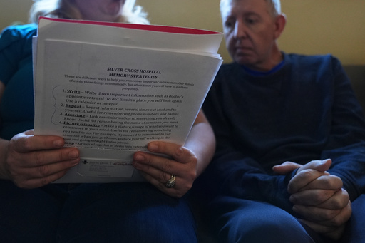 Bill Swick, right, studies with his wife Martha Swick at their home in Minooka, Ill., Friday, Oct. 24, 2025. (AP Photo/Nam Y. Huh) Bill Swick, right, studies with his wife Martha Swick at their home in Minooka, Ill., Friday, Oct. 24, 2025. (AP Photo/Nam Y. Huh)