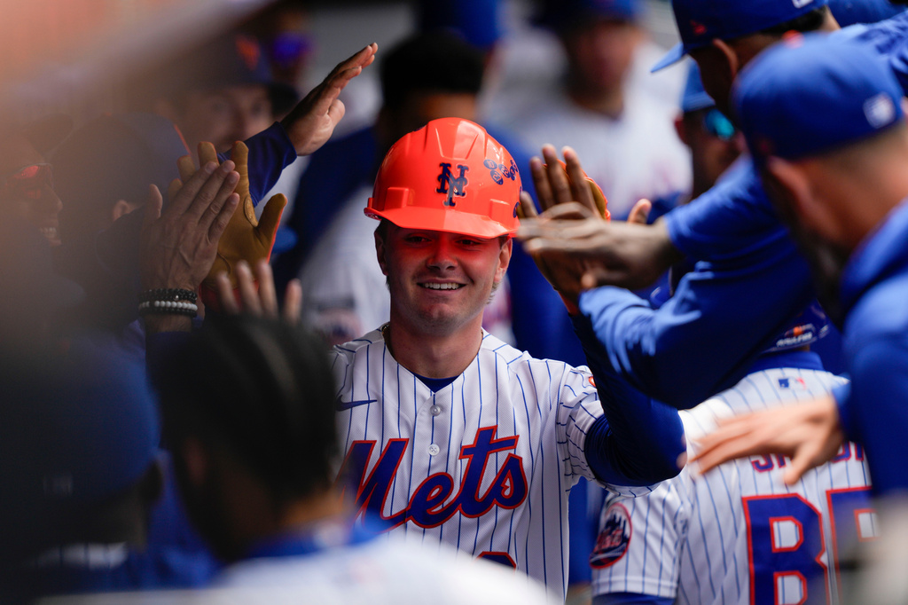 New York Mets' A.J. Ewing (9) celebrates in the dugout with teammates after hitting a home run during the third inning of a baseball game against the Detroit Tigers, Thursday, May 14, 2026, in New York. (AP Photo/Yuki Iwamura)