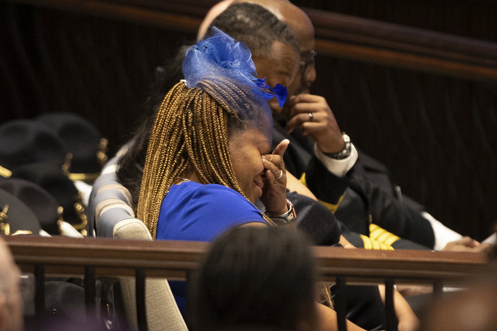 The mother of DeKalb County Police Officer David Rose is emotional during his funeral service at First Baptist Church Atlanta in Atlanta, Friday, Aug. 22, 2025. Rose was killed while responding to a shooting at the CDC. (Arvin Temkar/Atlanta Journal-Constitution via AP)