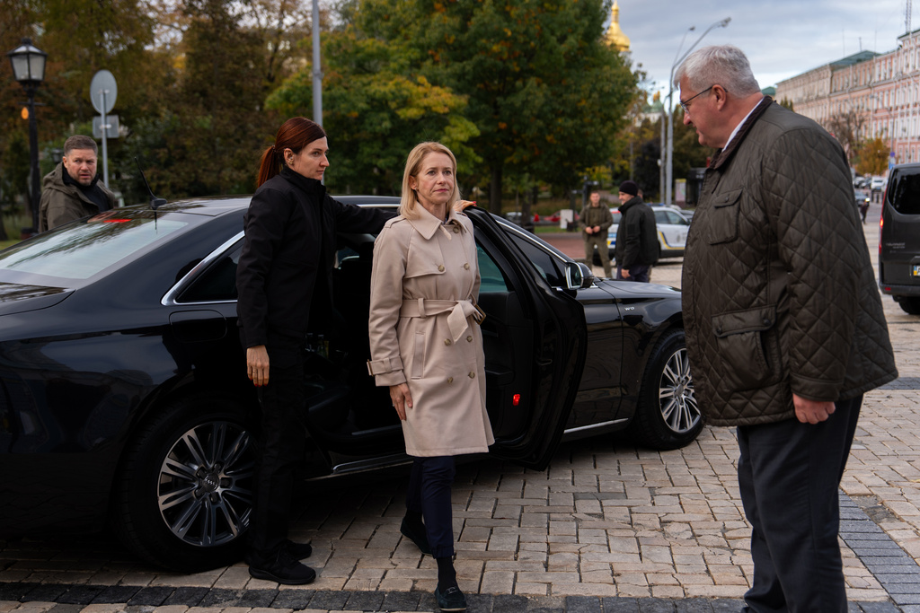 High Representative of the European Union for Foreign Affairs and Security Policy Kaja Kallas, centre, and Ukraine's Foreign Minister Andrii Sybiha, right, meet outside St. Michael's monastery, Monday, Oct. 13, 2025, in Kyiv, Ukraine. (AP Photo/Julia Demaree Nikhinson)