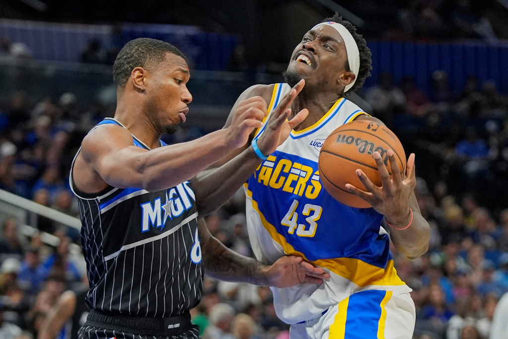 Indiana Pacers forward Pascal Siakam (43) drives against Orlando Magic forward Jamal Cain, left, during the second half of an NBA basketball game, Monday, March 23, 2026, in Orlando, Fla. (AP Photo/John Raoux)