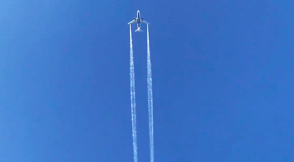 FILE - In this photo from video, Delta Air Lines Flight 89 to Shanghai, China dumps fuel over Los Angeles before returning to Los Angeles International Airport for an emergency landing on Jan. 14, 2020. (AP Photo/Matt Hartman, File)