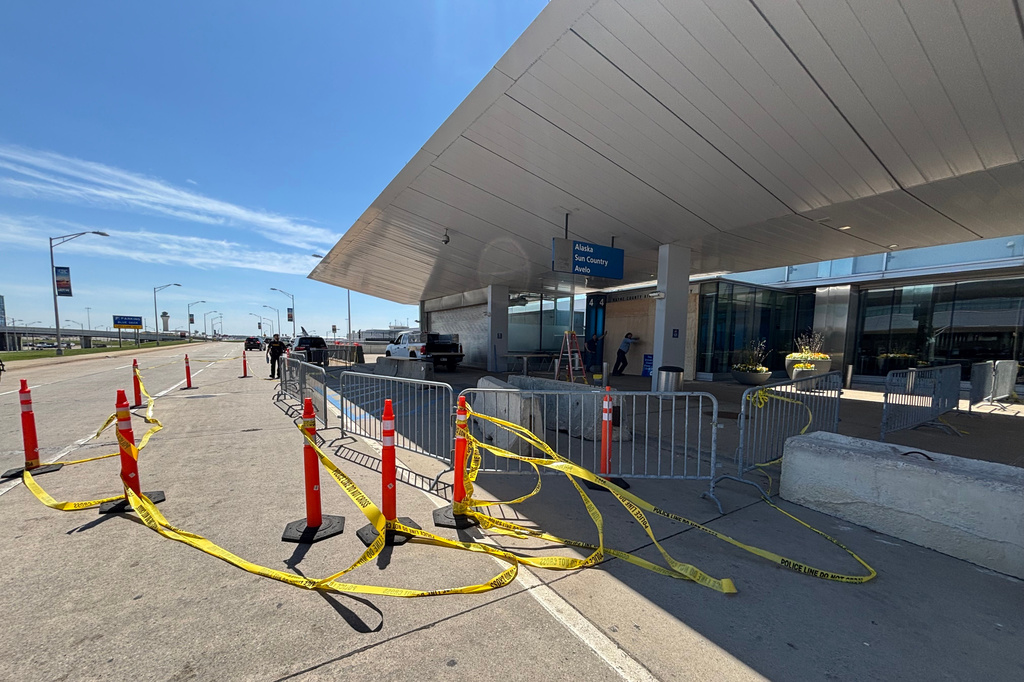 Police tape surrounds the site where a driver crashed his vehicle into the Evans Terminal at Detroit Metropolitan Airport in Romulus, Mich., on Friday, May 29, 2026. (Fuad Shalhout/MLive.com via AP)