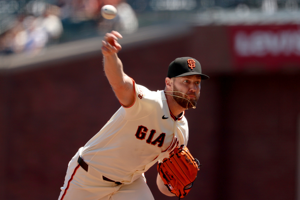 San Francisco Giants pitcher Adrian Houser throws against the San Diego Padres during the first inning of a baseball game in San Francisco, Wednesday, May 6, 2026. (AP Photo/Jed Jacobsohn)