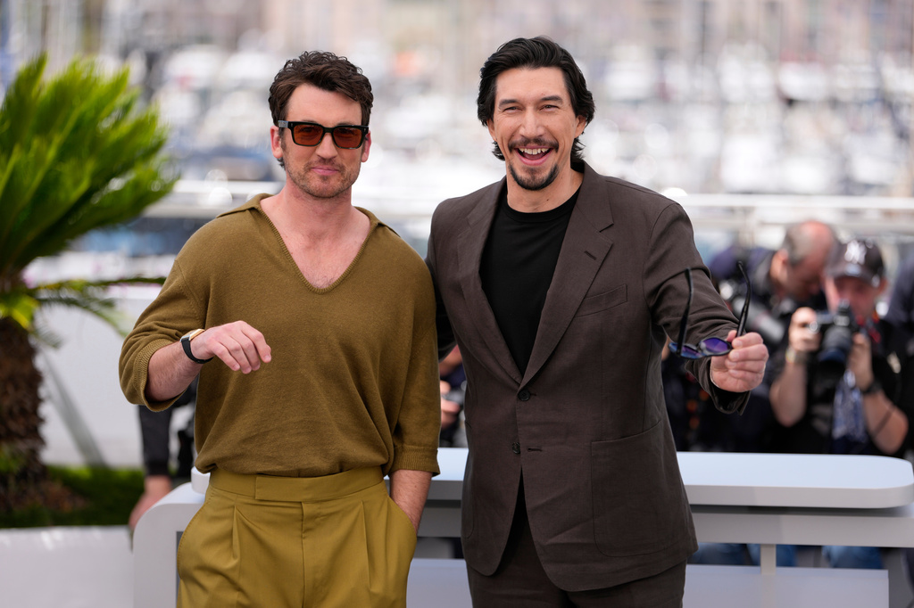 Miles Teller, left, and Adam Driver pose for photographers at the photo call for the film 'Paper Tiger' during the 79th international film festival, Cannes, southern France, Sunday, May 17, 2026. (AP Photo/John Locher)