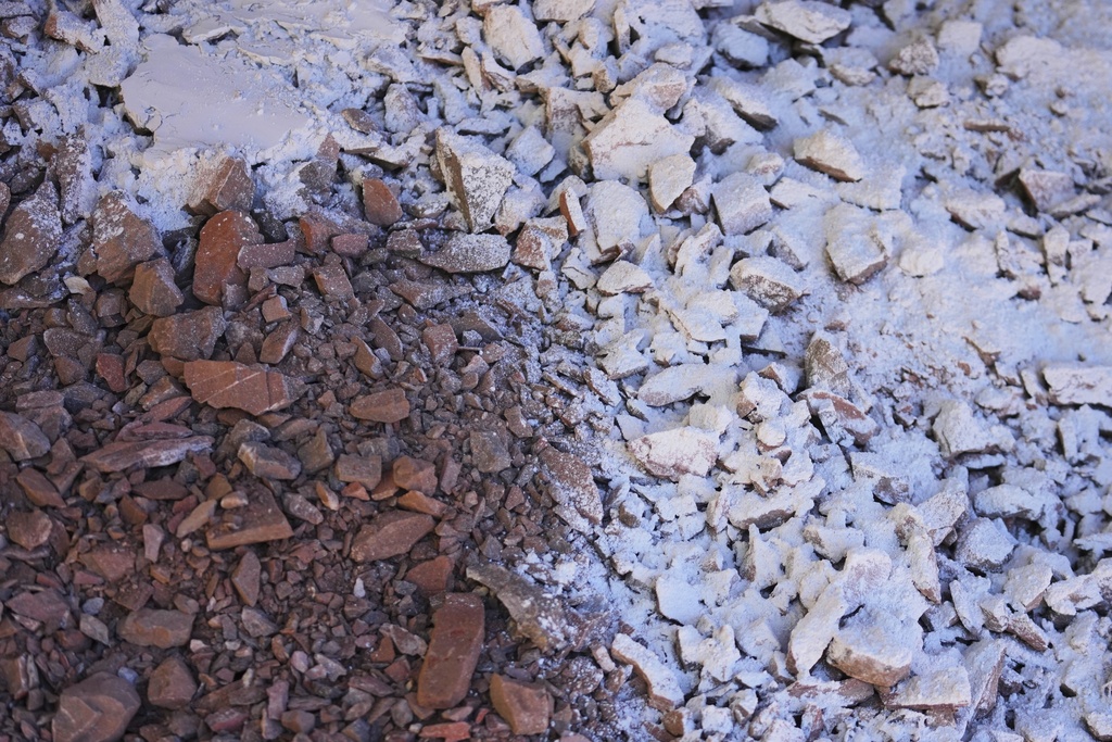 Mercury ore is mixed with a lime chemical powder to boost the combustion when it bakes to create mercury in San Joaquin, Mexico, Tuesday, Aug. 19, 2025. (AP Photo/Fernando Llano)