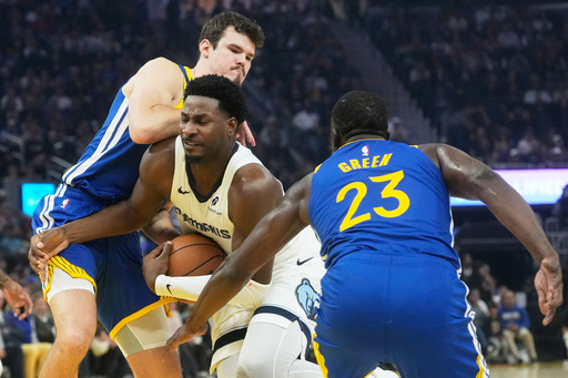 Memphis Grizzlies forward Jaren Jackson Jr., middle, is fouled by Golden State Warriors center Quinten Post, top, while driving to the basket forward Draymond Green (23) during the first half of against an NBA basketball game in San Francisco, Monday, Oct. 27, 2025. (AP Photo/Jeff Chiu) Memphis Grizzlies forward Jaren Jackson Jr., middle, is fouled by Golden State Warriors center Quinten Post, top, while driving to the basket forward Draymond Green (23) during the first half of against an NBA basketball game in San Francisco, Monday, Oct. 27, 2025. (AP Photo/Jeff Chiu)