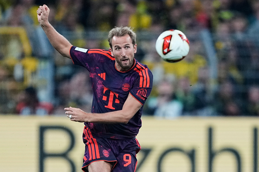Bayern's Harry Kane kicks the ball during the Franz Beckenbauer German Supercup soccer match between Borussia Dortmund and Bayern Munich in Dortmund, Germany, Saturday, Aug. 22, 2026. (AP Photo/Martin Meissner)