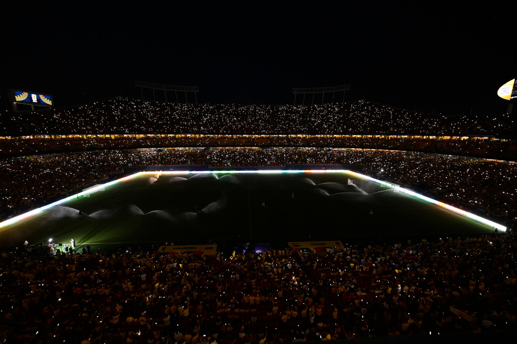Fans take part in a light show with their mobile phones during halftime in the World Cup round of 32 soccer match between Colombia and Ghana in Kansas City, Mo., Friday, July 3, 2026. (AP Photo/Reed Hoffmann)