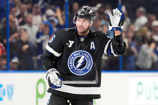 Tampa Bay Lightning right wing Nikita Kucherov (86) waves to the fans after picking up an assist, for his 1,000th career point, on a goal by Brayden Point during the second period of an NHL hockey game against the Anaheim Ducks Saturday, Oct. 25, 2025, in Tampa, Fla. (AP Photo/Chris O'Meara) Tampa Bay Lightning right wing Nikita Kucherov (86) waves to the fans after picking up an assist, for his 1,000th career point, on a goal by Brayden Point during the second period of an NHL hockey game against the Anaheim Ducks Saturday, Oct. 25, 2025, in Tampa, Fla. (AP Photo/Chris O'Meara)