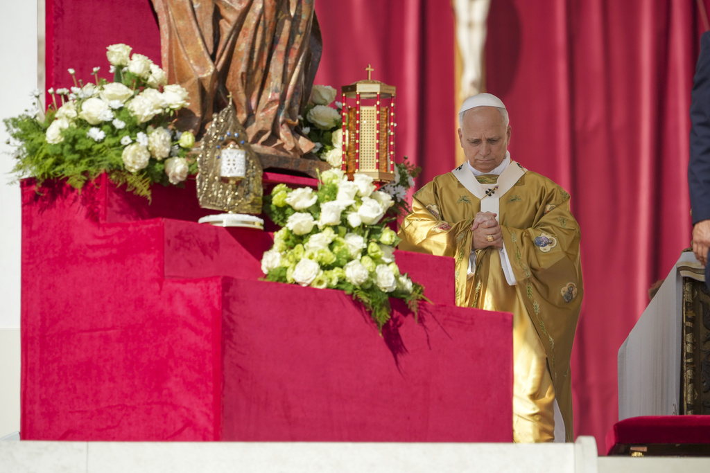 Relics of Carlo Acutis and Pier Giorgio Frassati, left, are displayed during their canonization Mass celebrated by Pope Leo XIV in St. Peter's Square at the Vatican Sunday, Sept. 7, 2025. (AP Photo/Andrew Medichini)