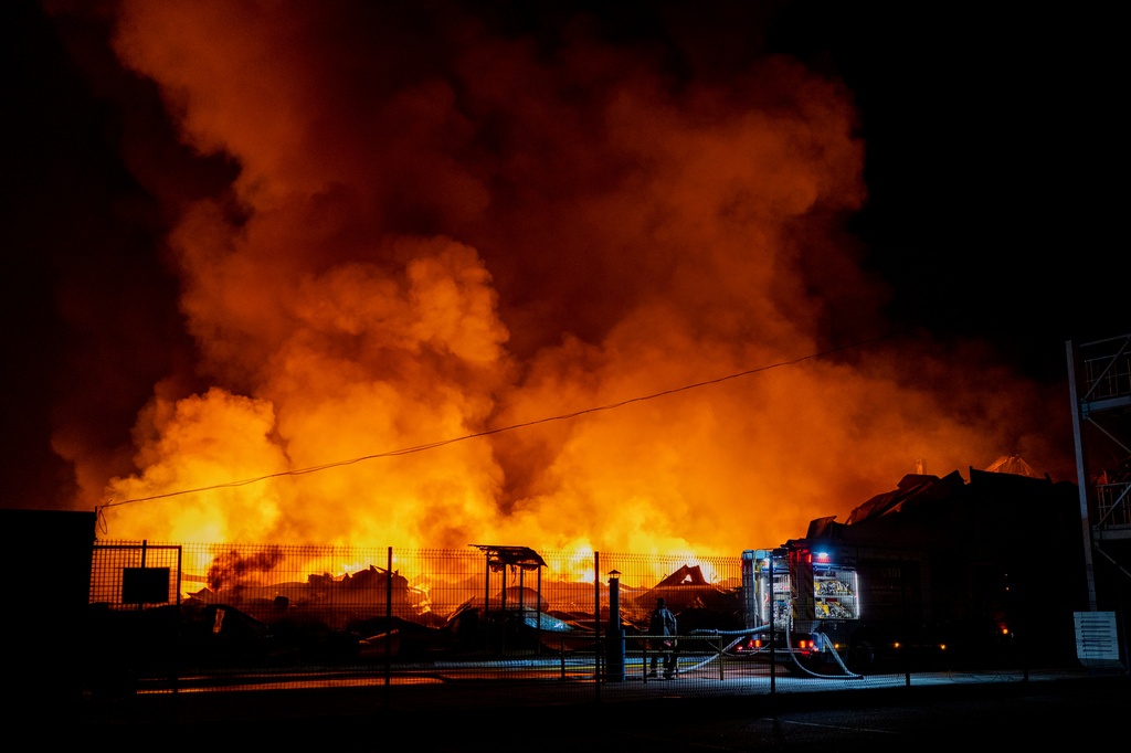 Firefighters put out a fire after Russian missiles hit a warehouse in Kyiv, Ukraine, Wednesday, Aug. 5, 2026. (AP Photo/Dan Bashakov)