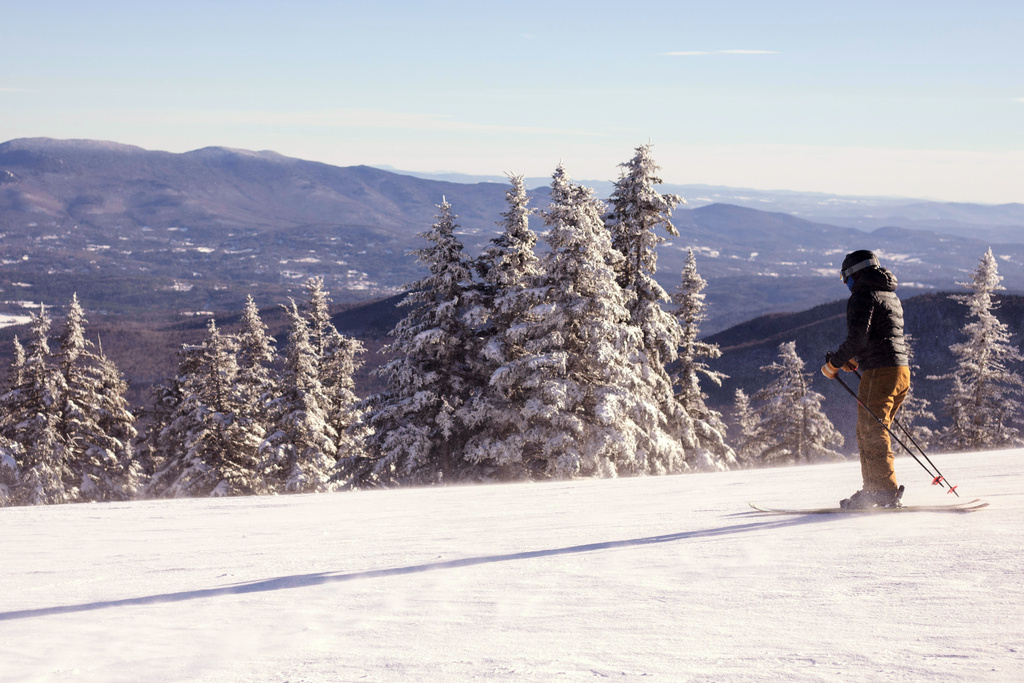 A skier moves down a crest at the Stowe Mountain Resort on Dec. 5, 2025 in Stowe, Vt. (AP Photo/Amanda Swinhart)