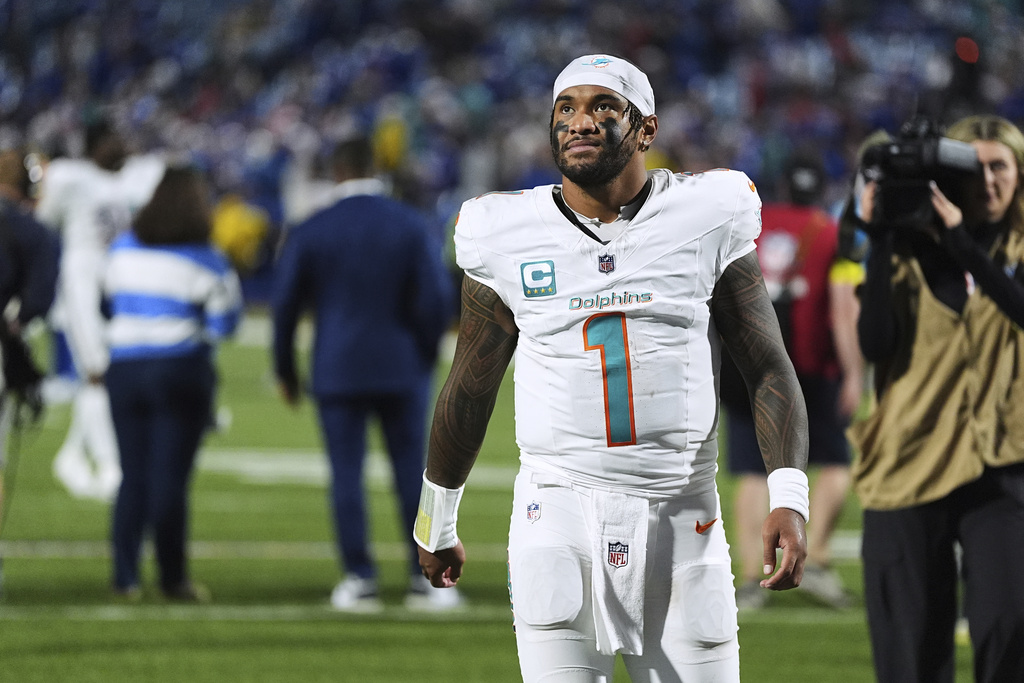 Miami Dolphins quarterback Tua Tagovailoa walks off the field after the team's loss to the Buffalo Bills in an NFL football game, Thursday, Sept. 18, 2025, in Orchard Park, N.Y. (AP Photo/Matt Rourke)