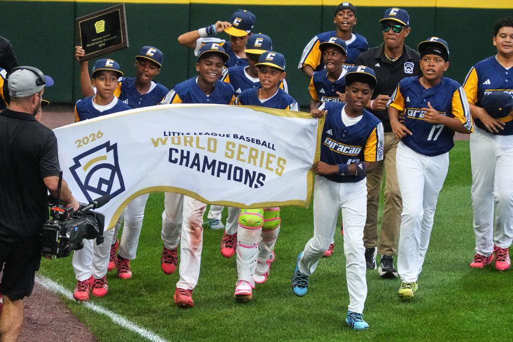 Curacao takes a victory lap after winning the Little League World Series Championship baseball game against Henderson, Nev., in South Williamsport, Pa., Sunday, Aug. 30, 2026. (AP Photo/Gene J. Puskar)