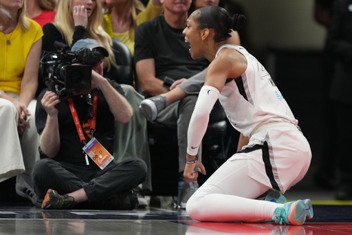 Las Vegas Aces' A'ja Wilson reacts after hitting a shot and getting fouled during second half of Game 3 of a WNBA basketball playoff semifinals series against the Indiana Fever, Friday, Sept. 26, 2025, in Indianapolis. (AP Photo/Darron Cummings) Las Vegas Aces' A'ja Wilson reacts after hitting a shot and getting fouled during second half of Game 3 of a WNBA basketball playoff semifinals series against the Indiana Fever, Friday, Sept. 26, 2025, in Indianapolis. (AP Photo/Darron Cummings)
