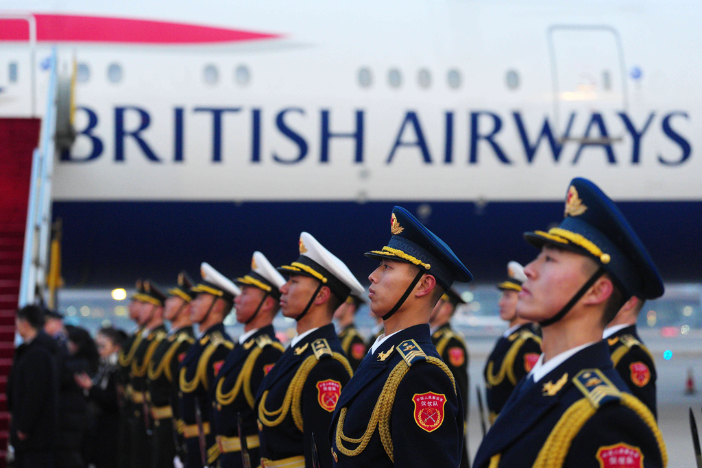 A guard of honour wait on the tarmac as the plane carrying British Prime Minister Keir Starmer arrives in Beijing, China, Wednesday Jan. 28, 2026. (Carl Court/Pool Photo via AP)