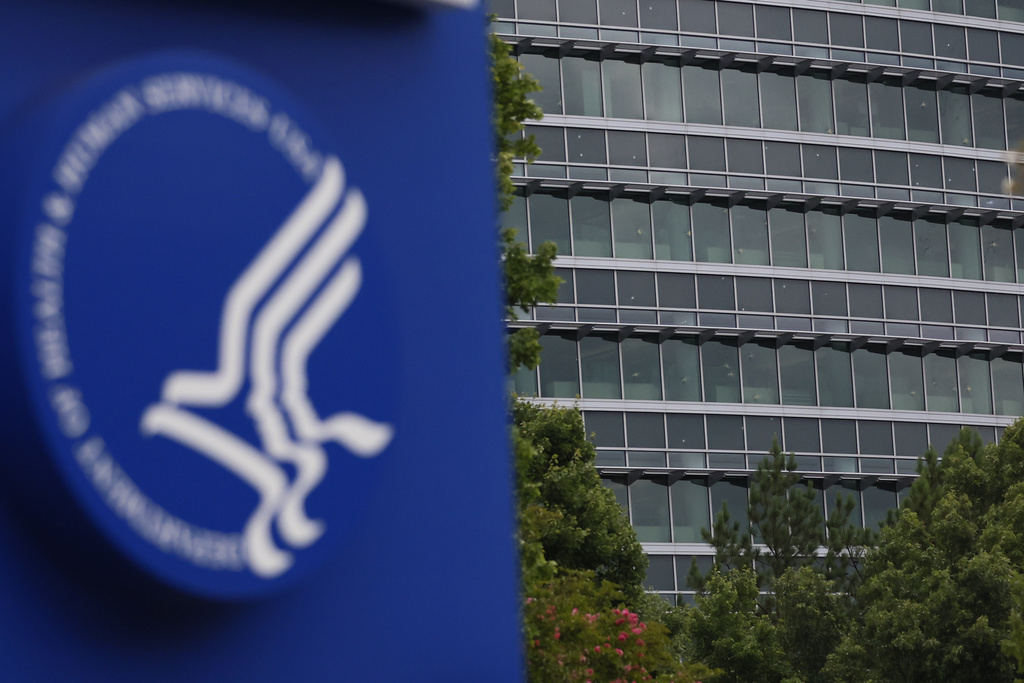 The notable bullet marks on the windows of the Centers for Disease Control and Prevention headquarters are visible from Clifton Rd, on Sunday, Aug. 10, 2025. (Miguel Martinez/Atlanta Journal-Constitution via AP)