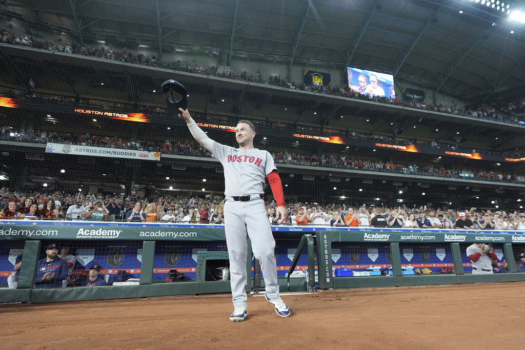 Boston Red Sox third baseman Alex Bregman acknowledges the fans after a video tribute before a baseball game against the Houston Astros Monday, Aug. 11, 2025, in Houston. (AP Photo/David J. Phillip)