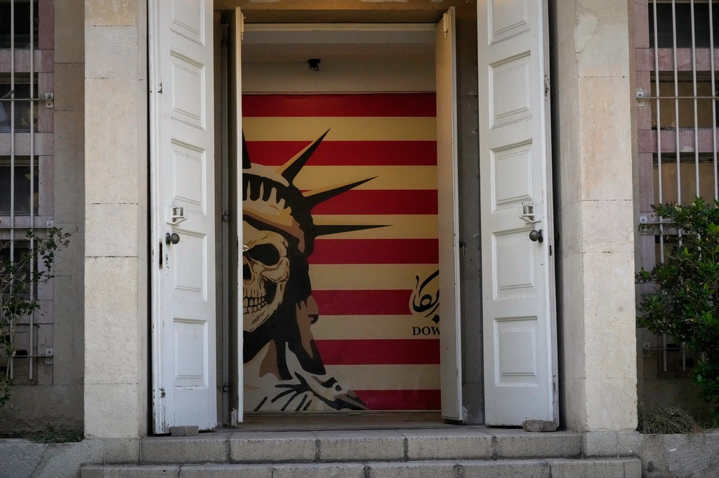 FILE - An interpretation of the Statue of Liberty and the U.S. flag decorate the entrance of the former U.S. Embassy, which was made into an anti-American museum, in Tehran, Iran, June 12, 2026. (AP Photo/Vahid Salemi, File)