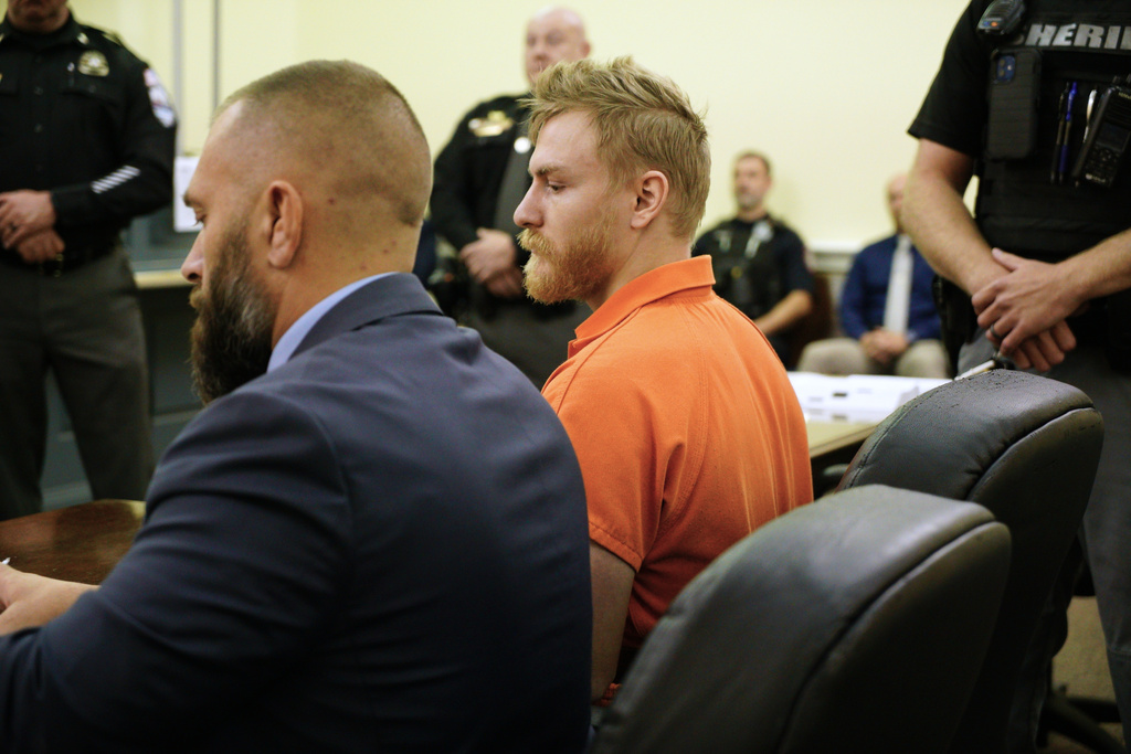 FILE - Shotsie Buck-Hayes sits beside defense attorney Edward Lavado in the General District Courtroom during a preliminary hearing in Danville, Va., Sept. 30, 2025. (AP Photo/Allen G. Breed, File)