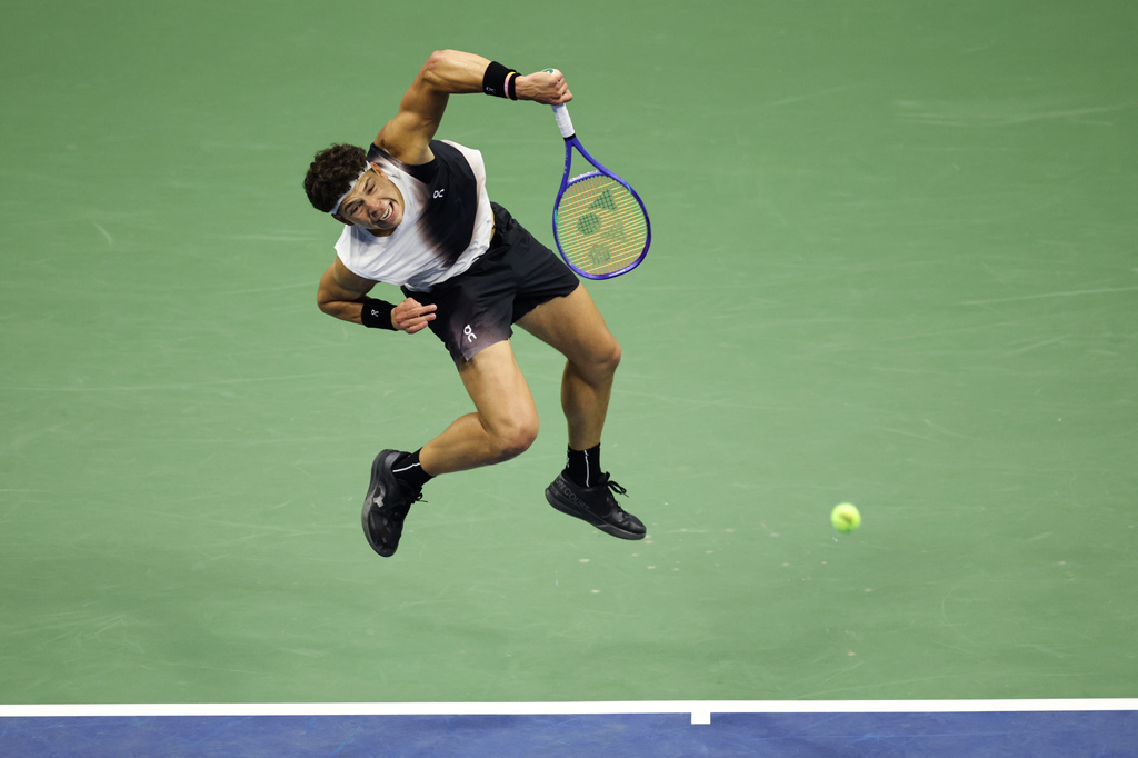 Ben Shelton, of the United States, serves to Denis Shapovalov, of Canada, during the third round of the U.S. Open tennis championships, early Saturday, Sept. 5, 2026, in New York. (AP Photo/Adam Hunger)