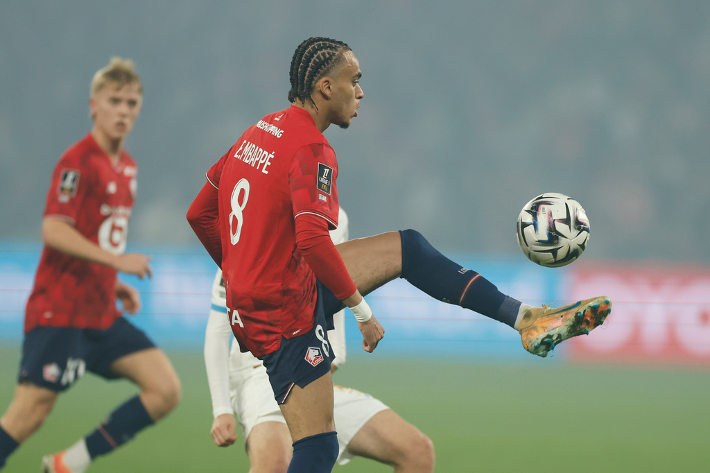 Lille's Ethan Mbappe controls the ball during the French League One soccer match between Lille and Marseille in Villeneuve-d'Ascq, outside Lille, France, Friday, Dec. 5, 2025. (AP Photo/Jean-Francois Badias)