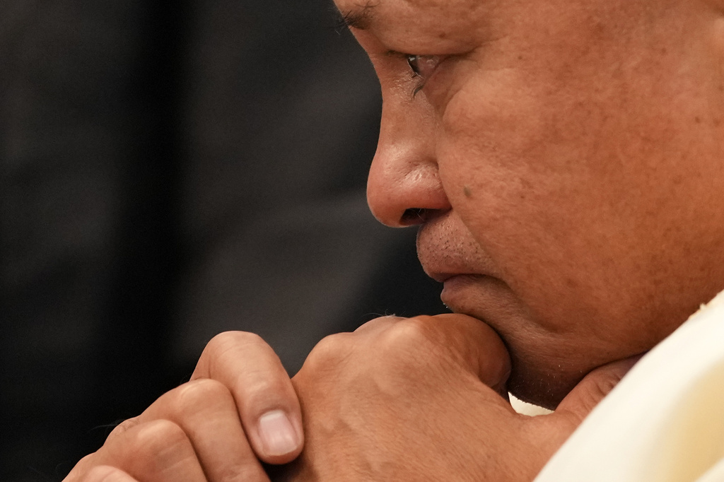 Philippine Senator Ronald dela Rosa becomes emotional while talking with other senators before the start of the session at the Philippine Senate in Pasay, Philippines on Tuesday, May 12, 2026. (AP Photo/Aaron Favila)