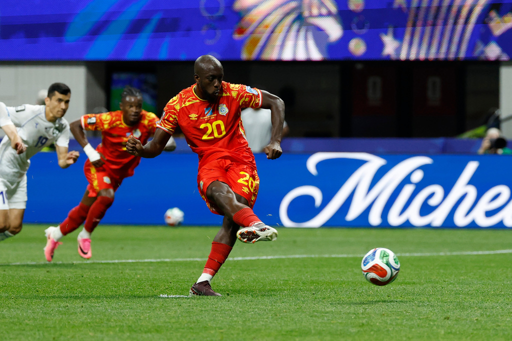 Congo's Yoane Wissa (20) kicks for a penalty kick goal during the World Cup Group K soccer match between DR Congo and Uzbekistan in Atlanta, Saturday, June 27, 2026. (AP Photo/Erik S. Lesser)