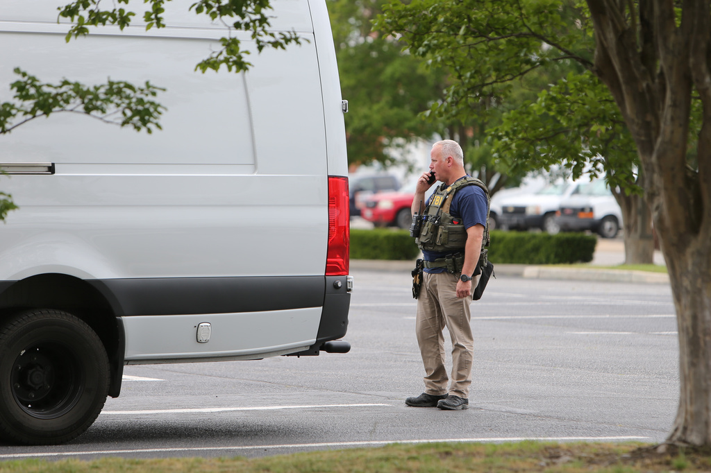 FBI personnel enter a building in Portsmouth, Va., Wednesday, May 6, 2026. (AP Photo/John Clark)