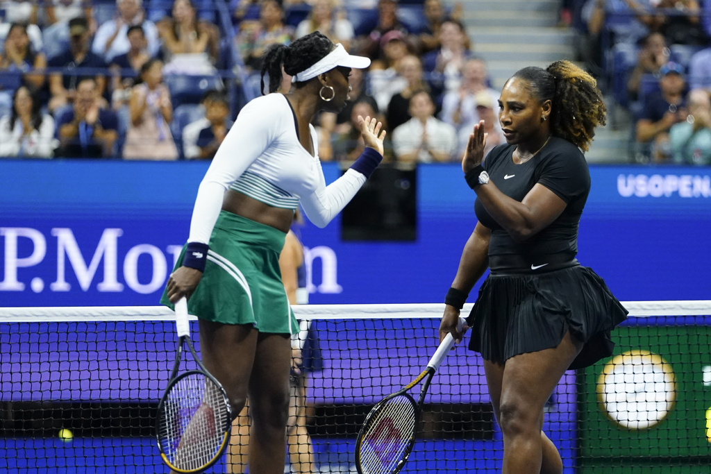 FILE - Serena Williams, right, and Venus Williams celebrate during their first-round doubles match against Lucie Hradecká and Linda Nosková, of the Czech Republic, at the U.S. Open tennis championships, Sept. 1, 2022, in New York. (AP Photo/Frank Franklin II, file)
