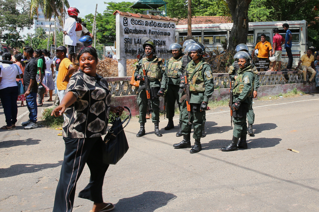 Security personnel stand guard outside a prison where deadly clashes broke out on Sunday, in Negombo, 35 kilometers (22 miles) north of the capital Colombo, Sri Lanka, Monday, July 6, 2026. (AP Photo)