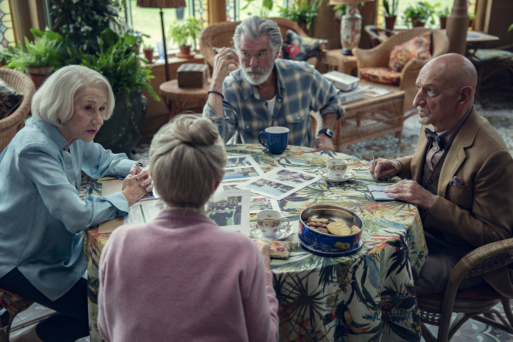 This image released by Netflix shows, clockwise from left, Helen Mirren, Pierce Brosnan, Ben Kingsley, and Celia Imrie in a scene from "The Thursday Murder Club." (Netflix via AP)