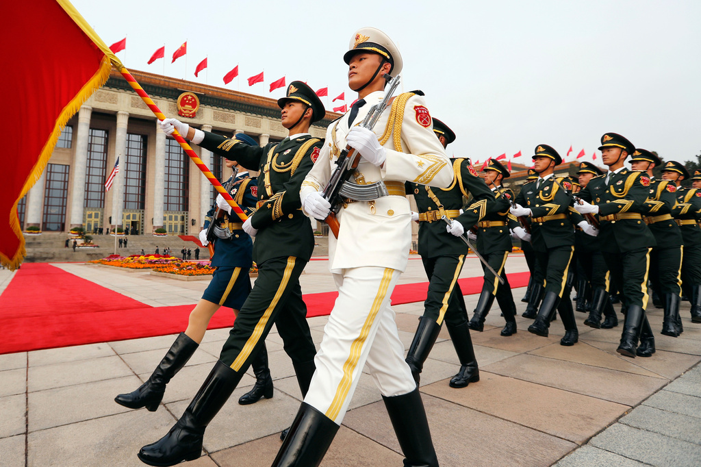 FILE - Members of an honor guard march as they prepare for a welcome ceremony for visiting U.S. President Donald Trump outside the Great Hall of the People in Beijing, Nov. 9, 2017. (AP Photo/Andy Wong, File)