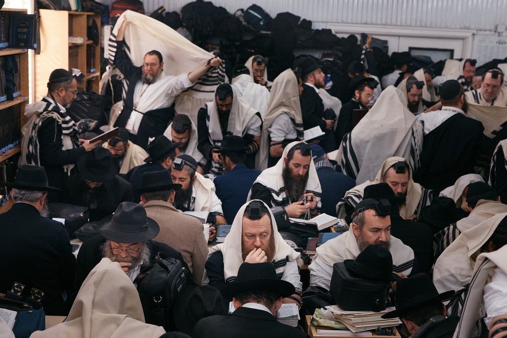 Chabad-Lubavitch rabbis gather in prayer at the resting place of the Rebbe, Rabbi Menachem M. Schneerson, one of Judaism’s most influential figures, in the Queens borough of New York on Friday, Nov. 14, 2025, during the International Conference of Chabad-Lubavitch Emissaries. (AP Photo/Andres Kudacki)