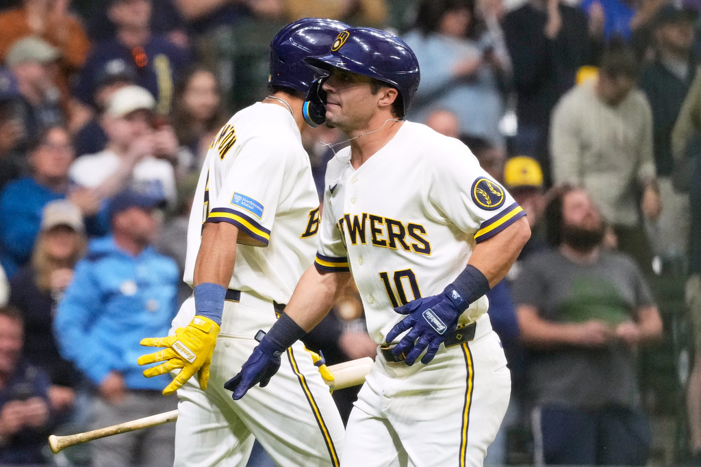Milwaukee Brewers' Sal Frelick, right, celebrates with David Hamilton after hitting a solo home run during the second inning of a baseball game against the Arizona Diamondbacks, Tuesday, April 28, 2026, in Milwaukee. (AP Photo/Nam Y. Huh)