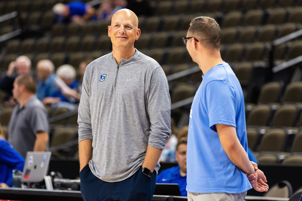 FILE - Creighton associate head coach Alan Huss, left, looks on before an NCAA college basketball exhibition game against Iowa State, Oct. 17, 2025, in Omaha, Neb. (AP Photo/Bonnie Ryan, File)